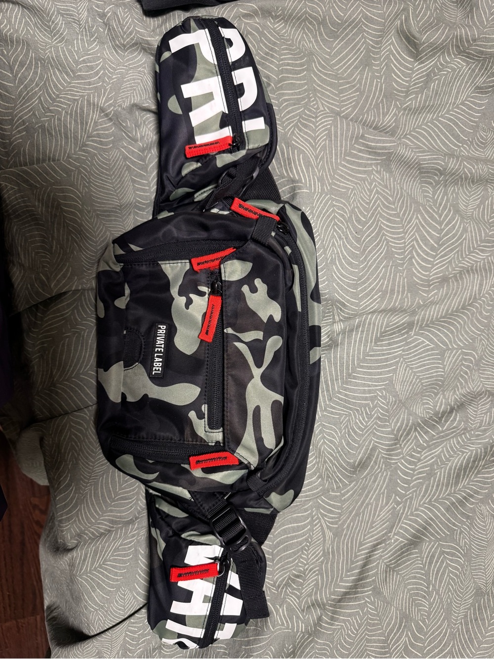 PRIVATE LABEL Black & Green Camo Sling Belt Bag with Red Accents